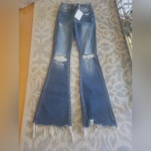 Flying Monkey flare dark wash jeans. Nevet worn size 24.